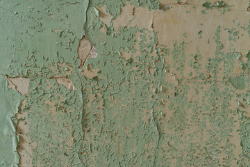 Textured going of greenish paint on a concrete wall in Amiantos abandoned hospital on Cyprus. Abandoned spaces - 248364583