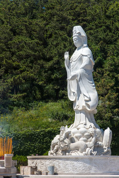 White statue of Buddha near Dianzi Village, in the North East of Beichangshandao Island, Changdao Islands, Shandong, China