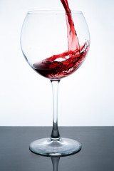 wine in glass on white background
