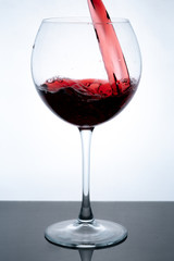 wine in glass on white background