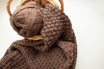 Knitting. Knitting. Knitted scarf. Brown scarf. Knitted pattern