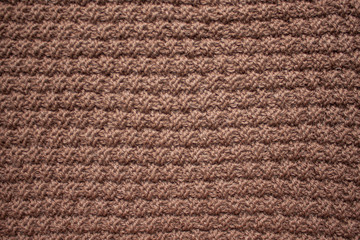 Fototapeta premium Knitting. Knitting. Knitted scarf. Brown scarf. Knitted pattern