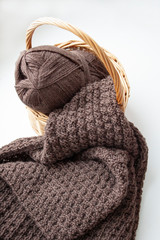 Knitting. Knitting. Knitted scarf. Brown scarf. Knitted pattern