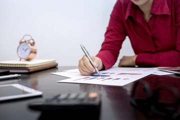 Business women working with financial reports at office.