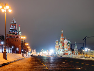 Fototapeta premium Famous landmarks - St. Basil Cathedral on Red square in Kremlin. Winter evening in Moscow, Russia.