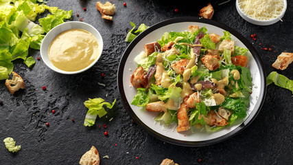 Caesar salad with chicken, anchous fish, croutons, parmesan cheese and greens. healthy food - obrazy, fototapety, plakaty