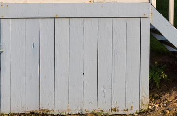 Section of white wood panelling from a seaside beach hut. Perfect as a background for Summer Holiday or seaside themes.