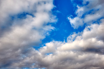 Storm cloud of rain with blue sky