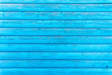Section of turquoise wood panelling from a seaside beach hut. Perfect as a background for Summer Holiday or seaside themes.