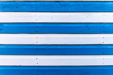 Section of blue and white wood panelling from a seaside beach hut. Perfect as a background for Summer Holiday or seaside themes.