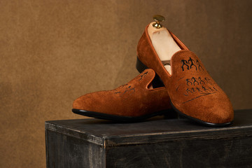 Men's shoes over dark background with copy space, close-up