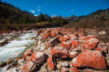 Red rock on stream and blue sky