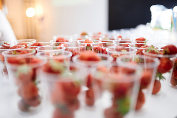 strawberry snack in plastic glasses 