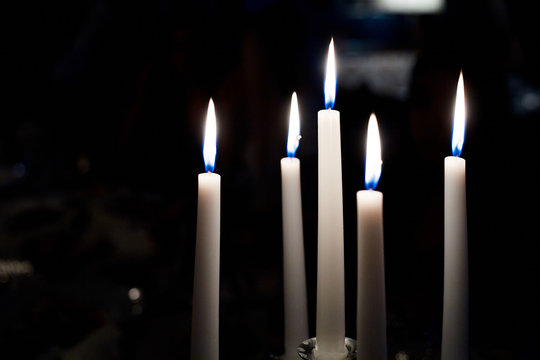 White candles in the darkness