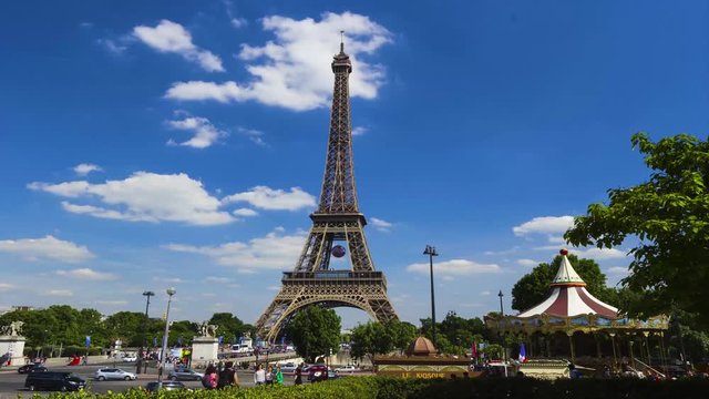 Eiffel Tower timelapse near a carousel in Paris, France, Europe