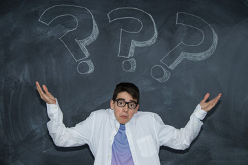 young teenager on the blackboard with question mark