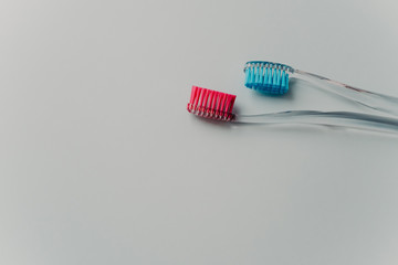 Healthy teeth and dental concept. Toothbrushes made of plastic isolated over white studio wall with empty space for your advertising content