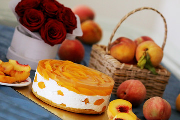 Peach mousse cake served with peaches