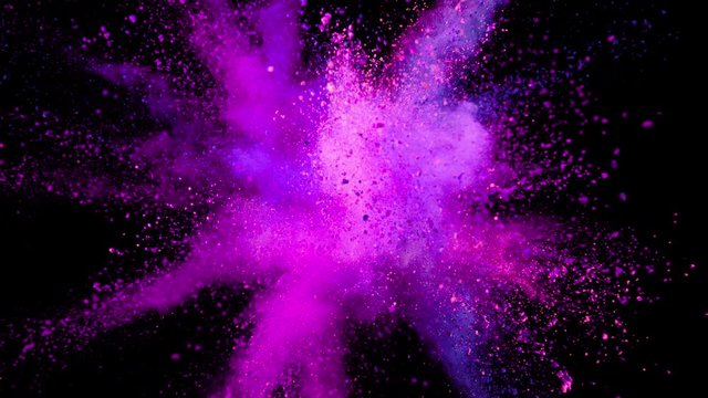 Super slow motion of coloured powder explosion isolated on black background. Filmed on high speed cinema camera, 1000 fps.