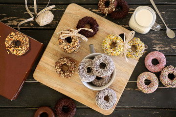 Colorful topped donuts served with milk