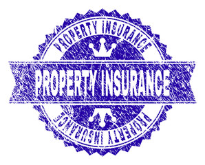 Obraz premium PROPERTY INSURANCE rosette stamp seal watermark with grunge style. Designed with round rosette, ribbon and small crowns. Blue vector rubber watermark of PROPERTY INSURANCE title with corroded style.