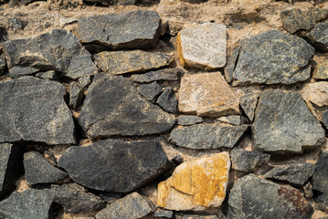 Old castle stone wall texture background in perspective