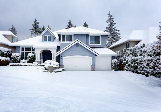 Rare snow storm in Northwest United States with residential home in background