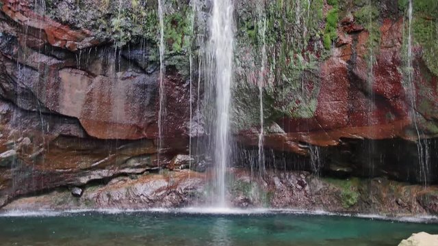 25 Fontes falls on Madeira. Beautiful waterfall in the midlle of green hills and woods.
