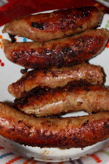 Baked homemade sausages in barbecues.