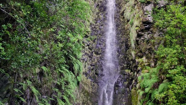 25 Fontes falls on Madeira. Beautiful waterfall in the midlle of green hills and woods.