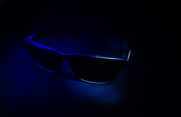 sunglasses on black background