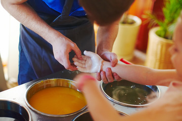 Funny entertainment on kids birhtday - paraffin molding hand shape