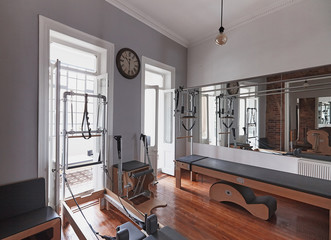 Pilates salon club with new equipment for pilates in loft style place