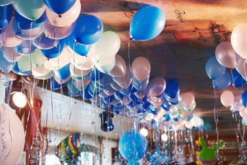 Celebration hall in restaurant decorated with balloons birthday party