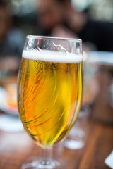 gold beer in beer mug service in the open air public bar