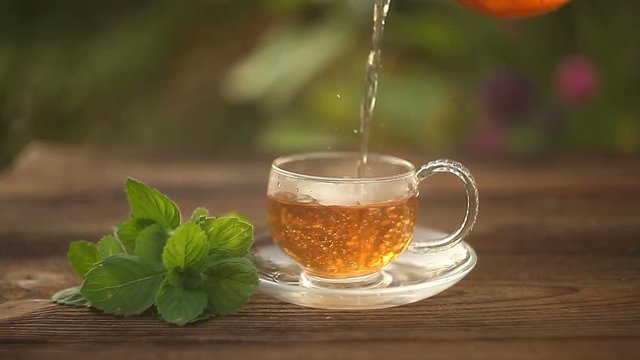 delicious green tea in a beautiful glass bowl on table