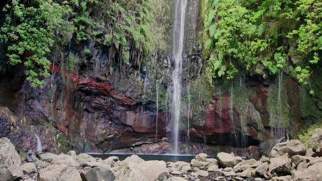 25 Fontes falls on Madeira. Beautiful waterfall in the midlle of green hills and woods.