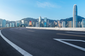 Fototapeta na wymiar Road and skyline of modern urban architecture in Hong Kong..