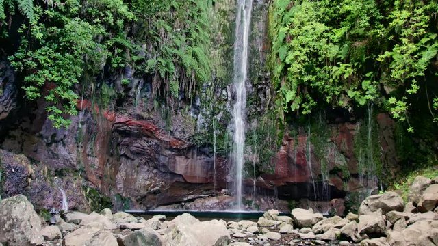25 Fontes falls on Madeira. Beautiful waterfall in the midlle of green hills and woods.