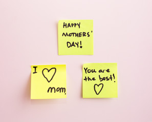 Happy Mother's Day note reminder yellow sticker on a wall,