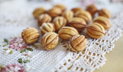 Traditional russian festive cookies in nut shape with caramelized milk inside