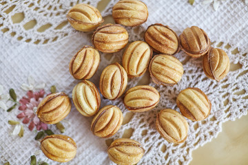 Traditional russian festive cookies in nut shape with caramelized milk inside