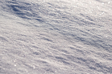 Fototapeta na wymiar Snow texture. Snowdrift close-up.