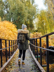 young traveling woman on bridge
