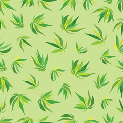 Vector seamless pattern with green leaves on a light green background