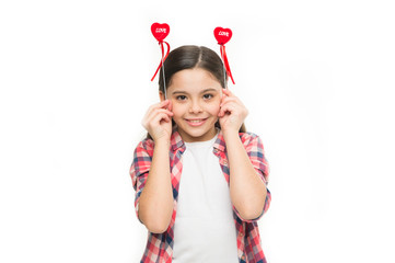 Making your heart melt for her. Small girl holding hearts on sticks. Funny girl with small red hearts. Small child with heart shaped decorations. Happy valentines day. The holiday of love and romance