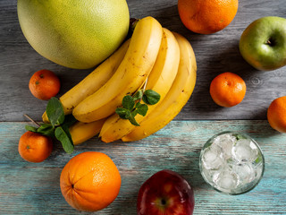 Apple, red green, bananas, oranges, tangerines, pomelo, juice, ice