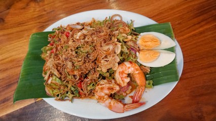 Winged Bean spicy salad and crispy shallot topping.