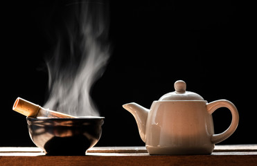 Hot matcha green tea on a black background 
