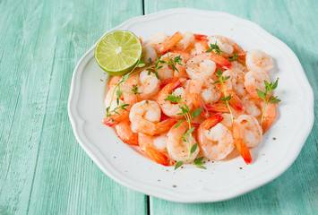 boiled shrimps on wooden surface